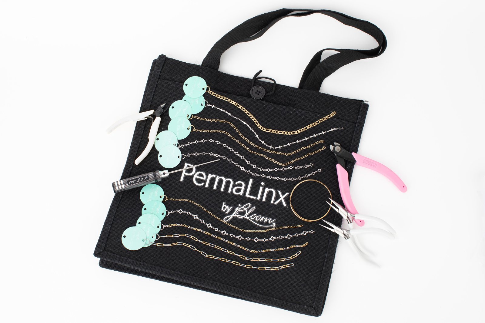 PermaLinx collection chains layered on a wrist
