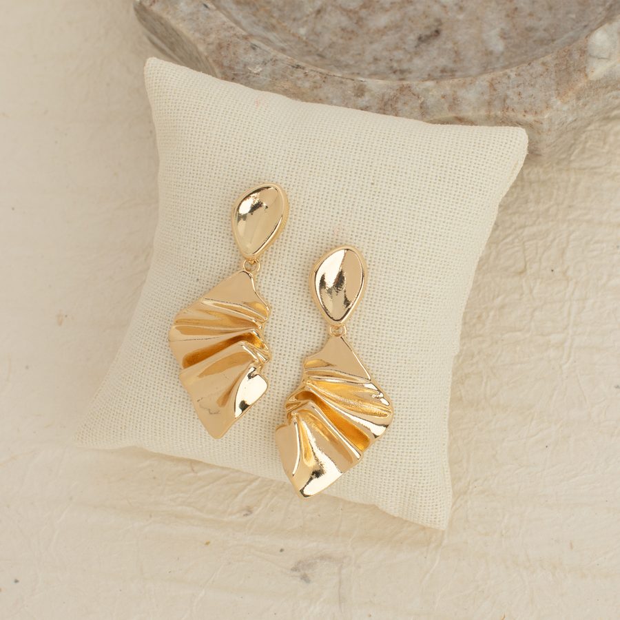 September Earring of the Month: pleated gold drop earrings on a linen pillow